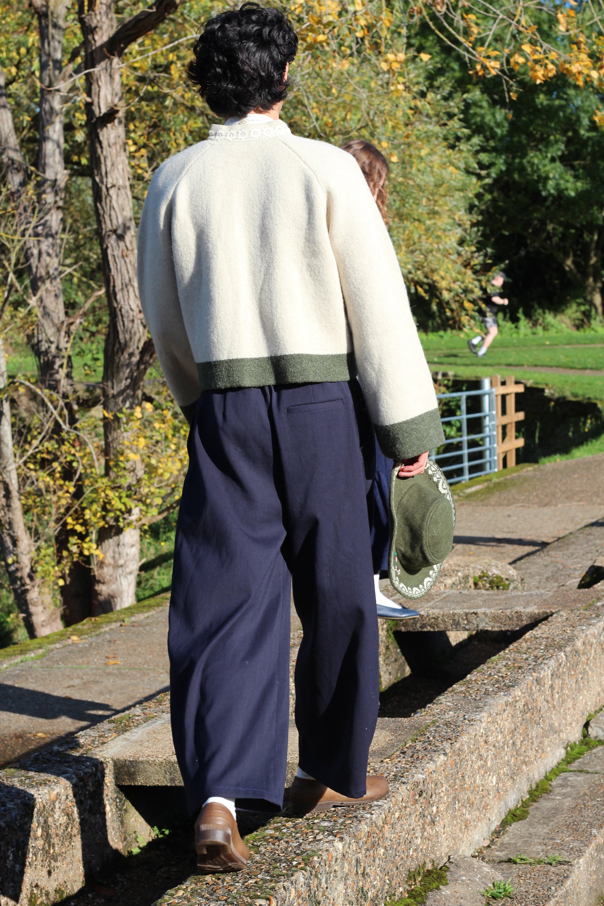 Unisex green wool hat back view cinematic long distance picture