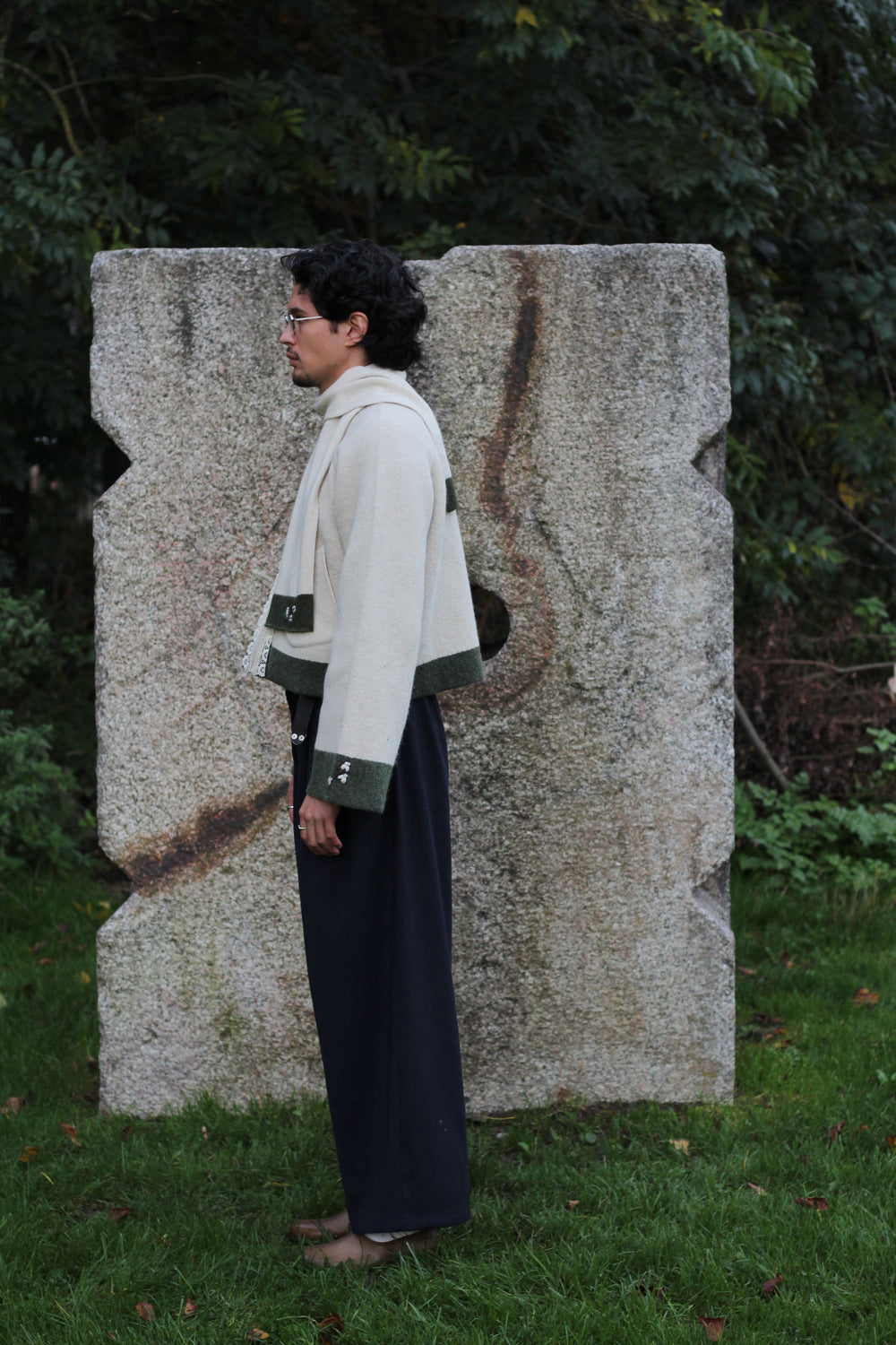 Unisex beige wool coat and Unisex beige wool scarf left side view middle distance
