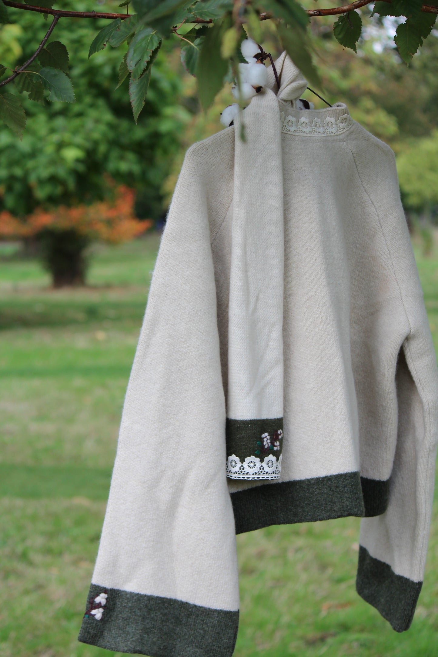 Unisex beige wool scarf with lacing back side product shot at middle distance