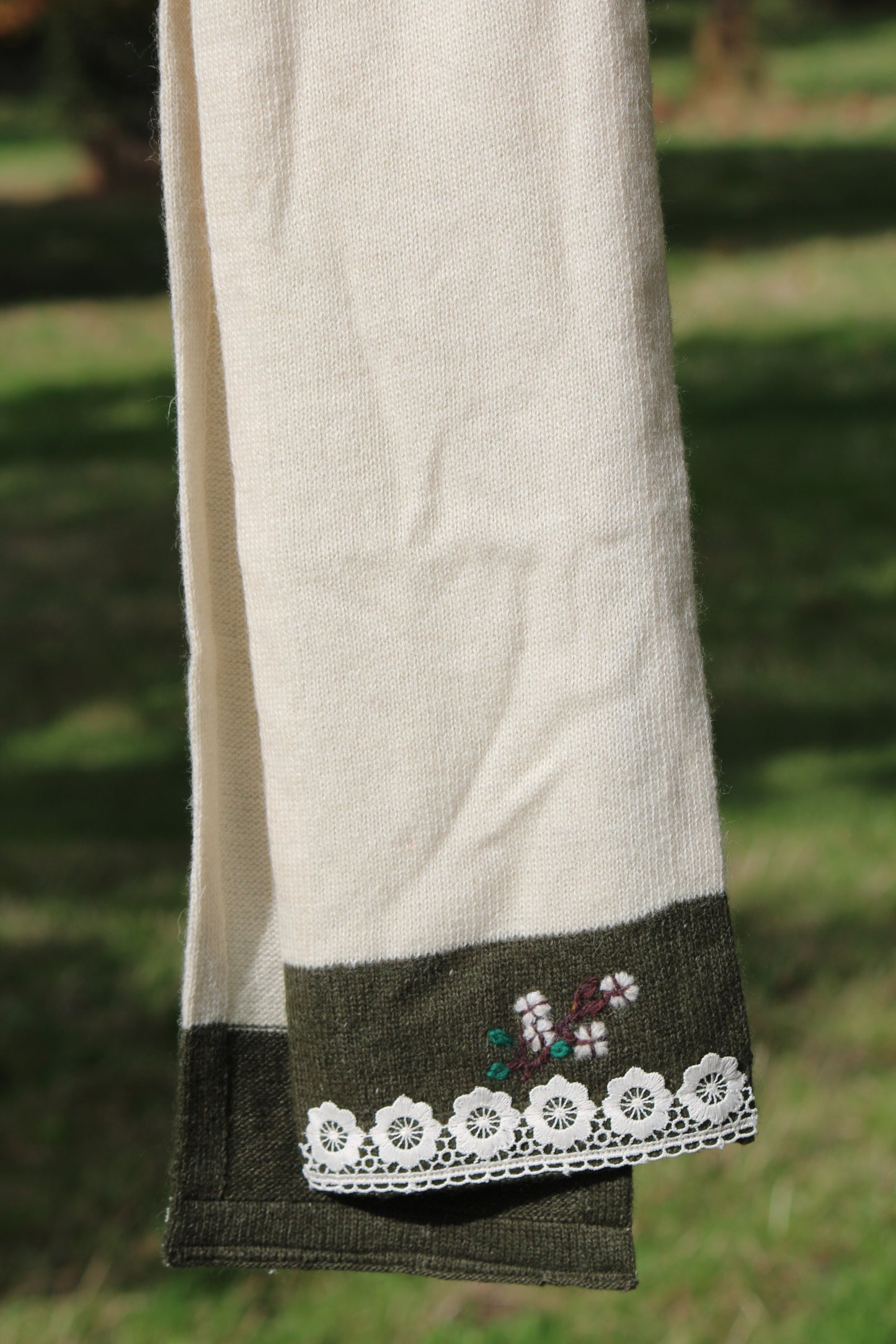 Unisex beige wool scarf with cotton lacing, close up detail shot